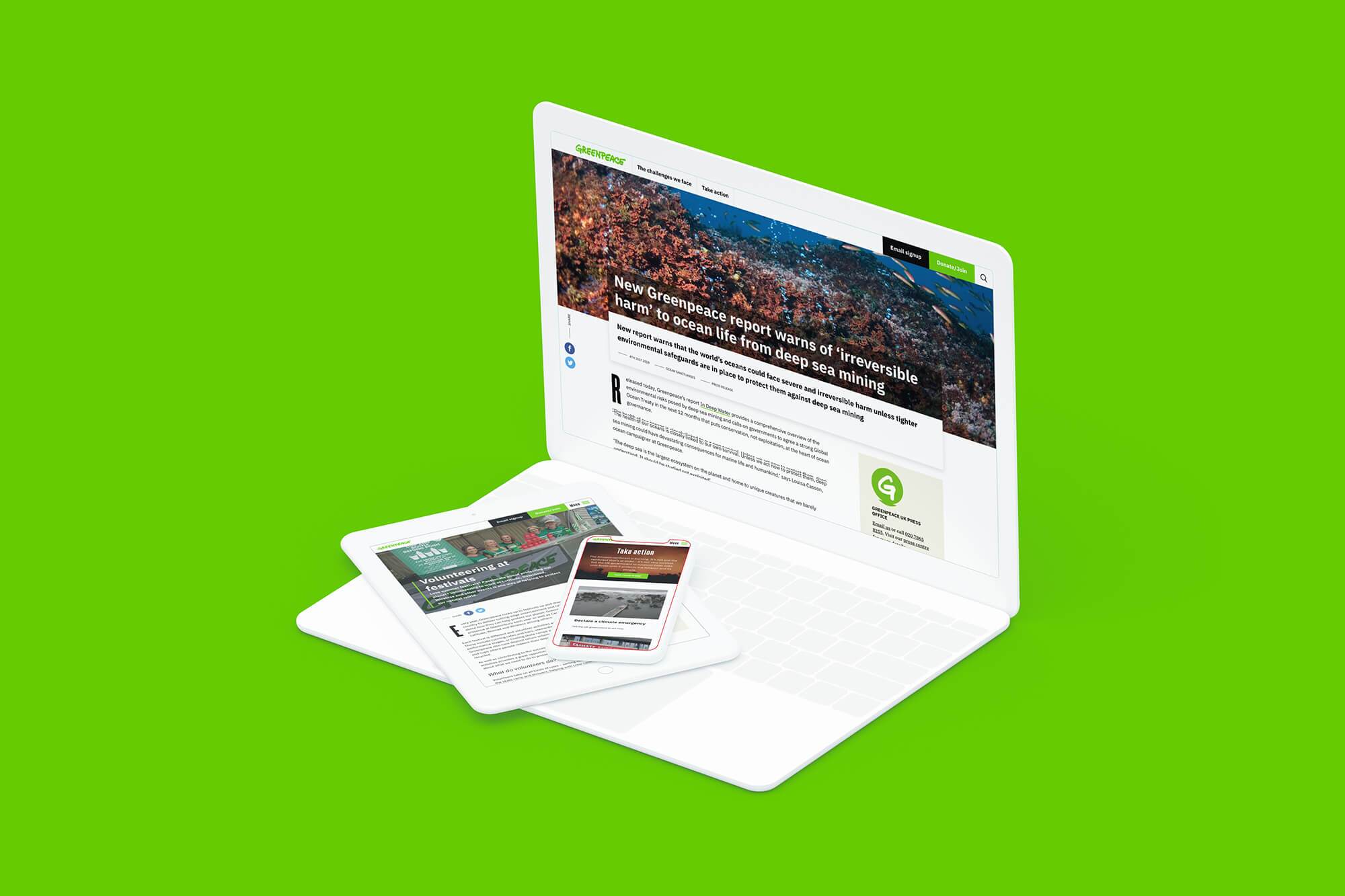 Greenpeace's site on a laptop with mobile and tablet on the keyboard