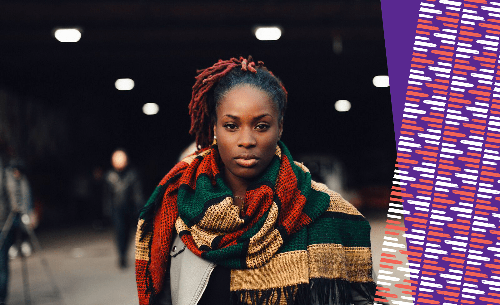 A powerful black women wearing a scarf staring at the camera