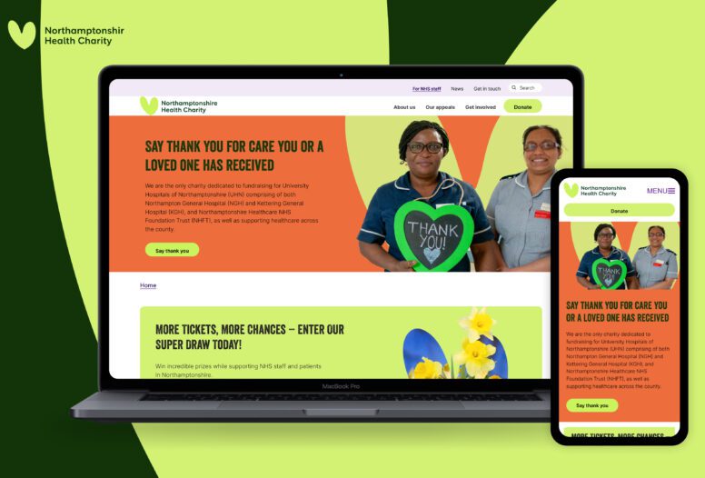 A laptop and smartphone display the Northamptonshire Health Charity website, featuring two smiling healthcare workers holding a green heart-shaped sign that says Thank You! on a bright, colorful background.